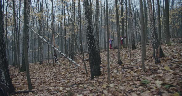 Two Scary Clowns Running Trough The Forest