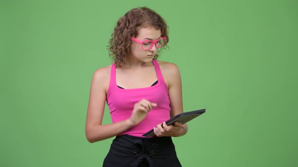 Young Happy Beautiful Nerd Woman Thinking While Using Digital Tablet