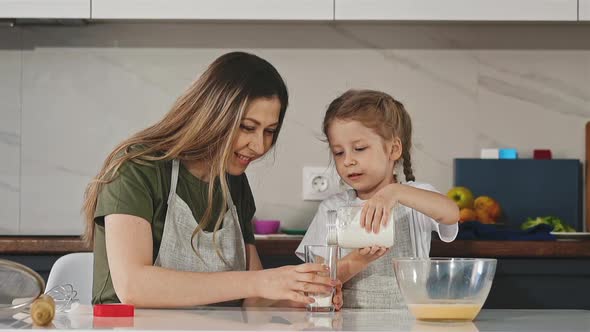 Mother and Daughter Cook Together Food