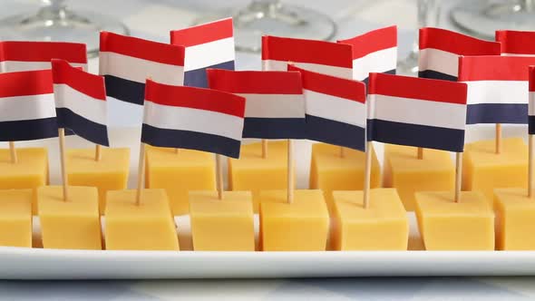 Dish with cubes of traditional mature Dutch Gouda cheese and flag sticks