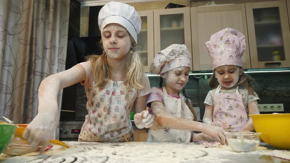 Girls playing with flour