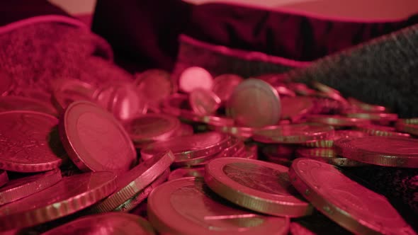 Motion Over Euro Coins on Fabric in Studio at Red Light