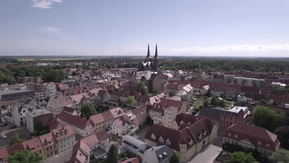 aerial from Kothen city to closeup of St jakob church during a sunny day