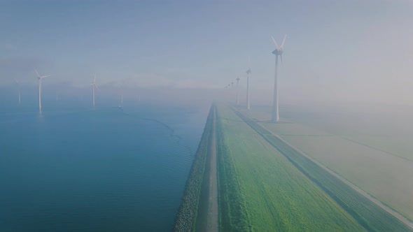 Offshore Windmill Park with Clouds and a Blue Sky Windmill Park in the Ocean Drone Aerial View with