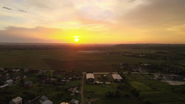 Aerial View of Residential Houses in Suburban Rural Area at Sunset