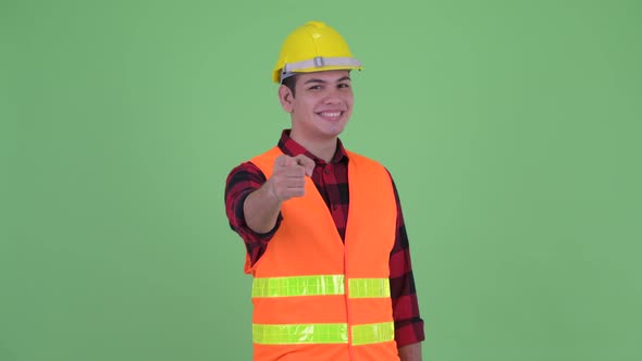 Happy Young Multi Ethnic Man Construction Worker Pointing at Camera