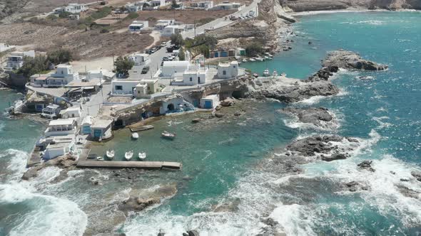 Wide Establishing Shot of Greek Fishing Village Build Right By the Ocean with Beautiful Turquoise