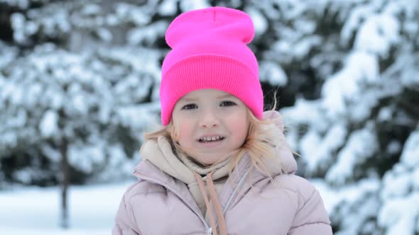 Cute Little Girl in Warm Hat Outdoors on Cold Winter