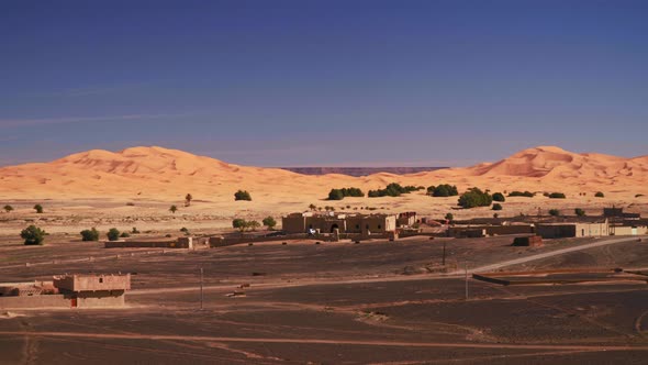 Panning shot of great sand dunes in Moroccan desert Merzouga