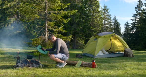 Male Traveller Near Campfire