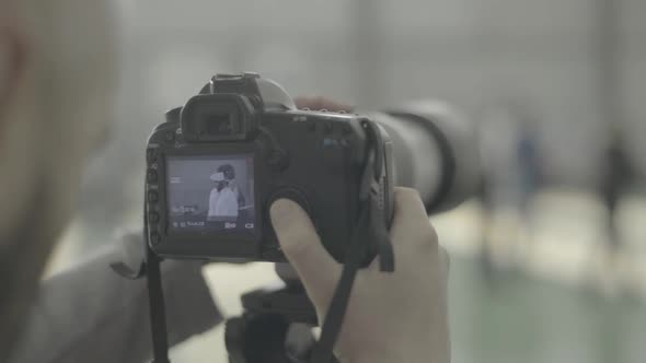 A Photographer (Cameraman) Shoots for Fencing Competitions. Slow Motion. Kyiv