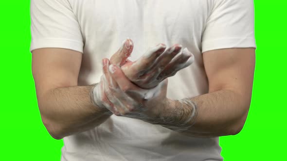Close Up Portrait of Man Thoroughly Washing His Hands