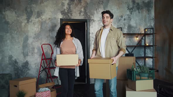 Young Multiracial Couple is Moving Into New Apartment