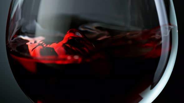 Super Slow Motion Detail Abstract Shot of Rippling Red Wine in Glass at 1000Fps