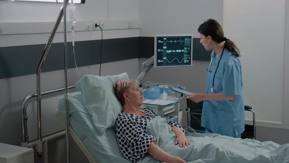 Woman Working As Nurse Using Oximeter for Oxygen Saturation