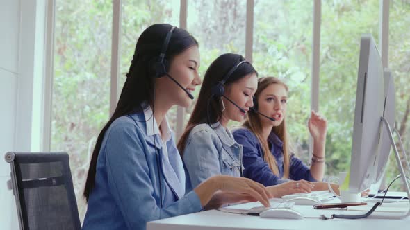 Customer Support Agent or Call Center with Headset Talking to Customer on Phone