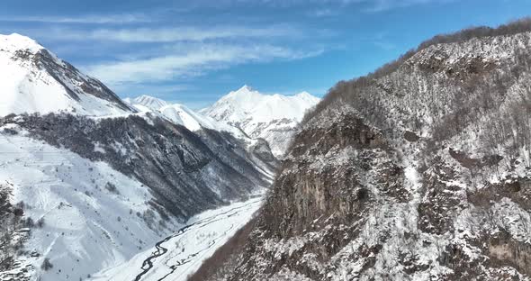 Aerial view of beautiful snowy mountains in Gudauri, Georgia