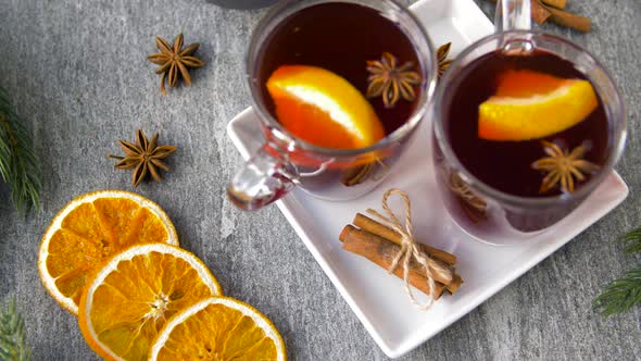 Glasses of Hot Mulled Wine with Orange and Spices 