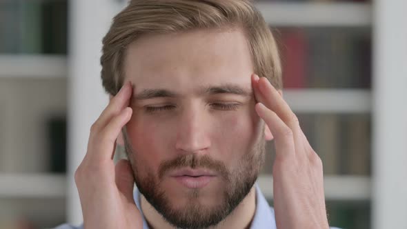 Close Up of Face of Man Having Headache