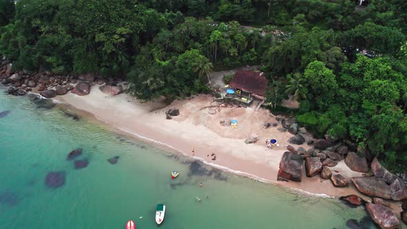 Paradisiac Lamberto Beach secluded turquoise water coast, aerial circle pan