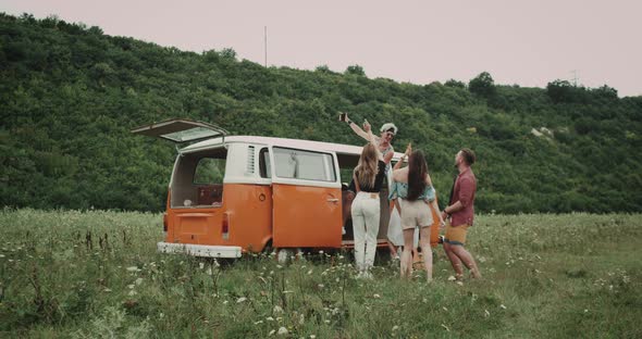 Dancing Young Friends at the Picnic Taking