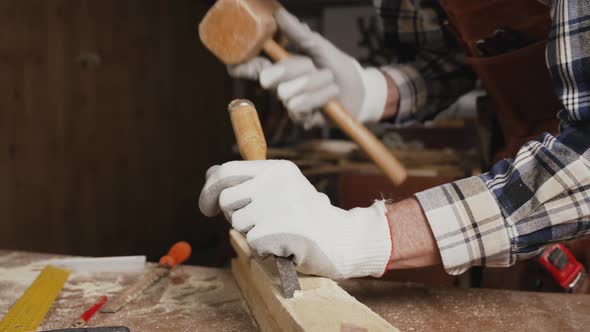 Carpenter Working At Workshop