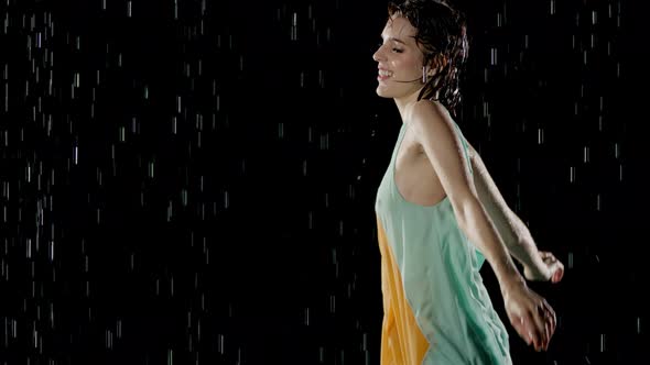 Beautiful Woman Dancing In The Rain