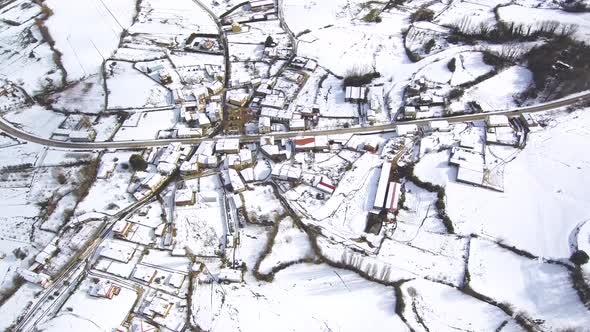 This is a footage of a drone, Aerial, Snow,Nature,Village.