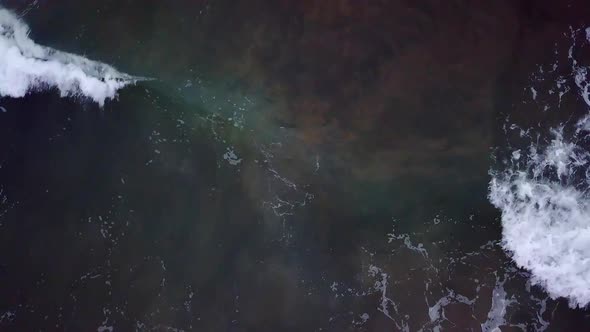 Aerial view looking down at waves on the ocean