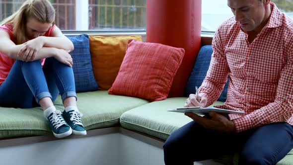 Teacher scolding student in library