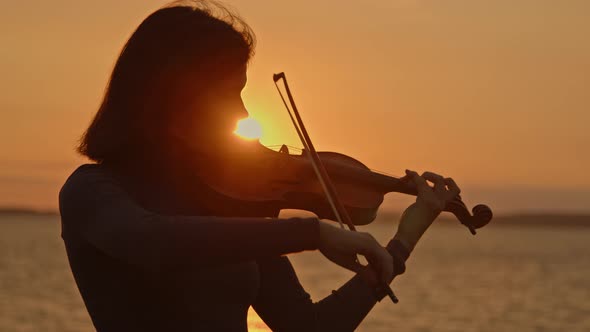 Lady Violinist Is Playing On Sunrise