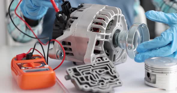 Mechanical Engineer Diagnosing Breakdown of Car Alternator Using Tester Closeup  Movie
