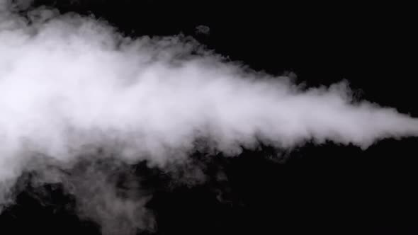 Water Vapor. White Jet of Vapour Steam on Black Background. Slow Motion