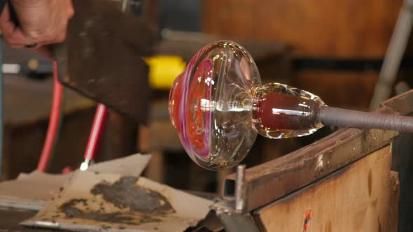 Glassworks glass manufacturing process - glass rolling on the marver