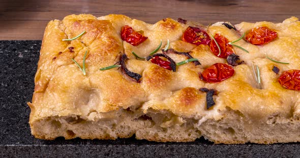 Traditional Italian Focaccia with pepperoni, cherry tomatoes, black olives, rosemary ando onion - ho