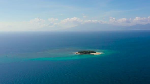 A Small Tropical Island with a White Beach