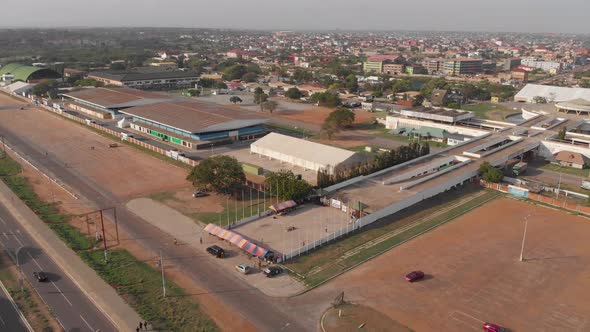 Ghana Trade Fair wide aerial track backwards wide