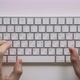 Male Hands Typing on a White Computer Keyboard - VideoHive Item for Sale