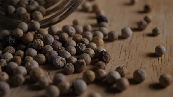 close up pepper grains on wood table
