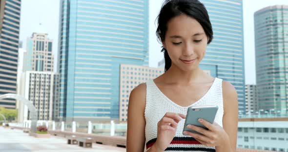 Woman using cellphone at outdoor 