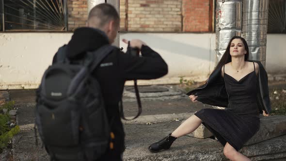 Photographer Photographs the Model at the Factory