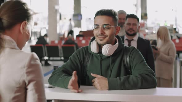 Multi-Ethnic People In Queue At Check-In