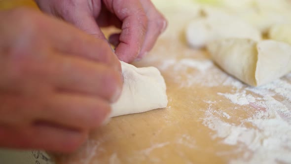 Female Hand Sculpts Meat Pies