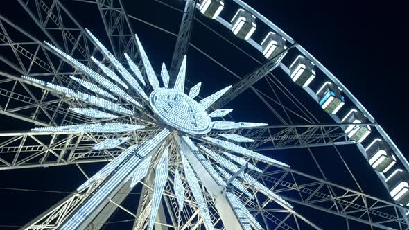 Ferris wheel in amusement park during night time