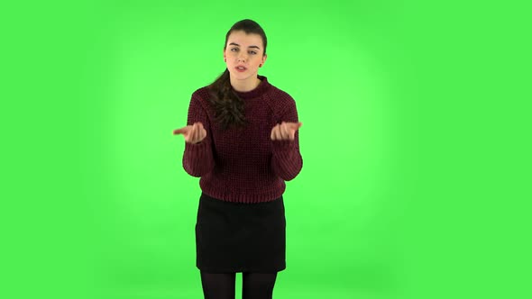 Girl Is Upset, Waving Her Hands in Indignation, Shrugs. Green Screen