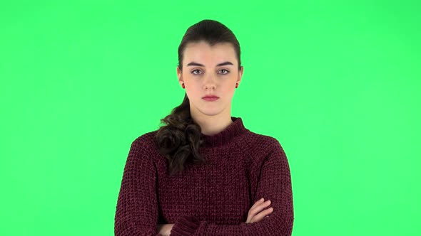 Lovely Girl Is Very Offended and Looks Away . Green Screen