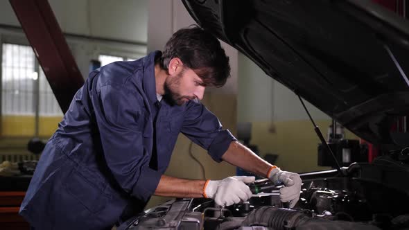 Auto Repair Specialist Replacing Car Oil Filter