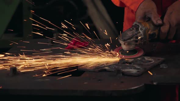 Professional Mechanic is Cutting Steel Metal