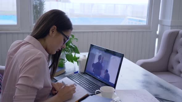 Distance Learning, Smart Girl Spectacled Passes Online Video Education for Self-development Uses