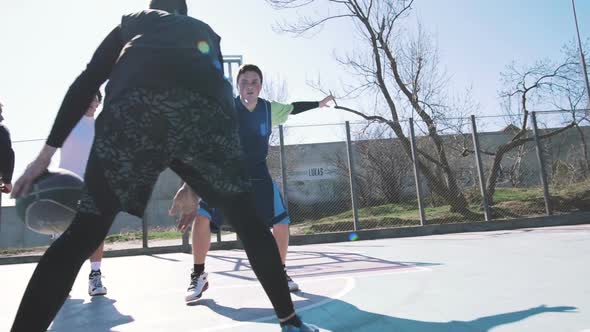 Group of People Playing Basketball Outdoors Slow Motion